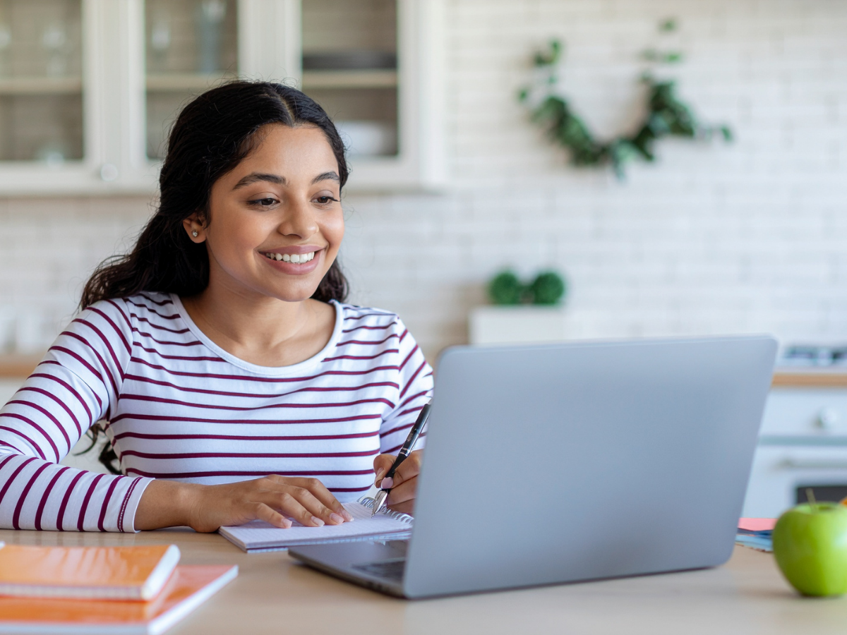 A student working at a laptop