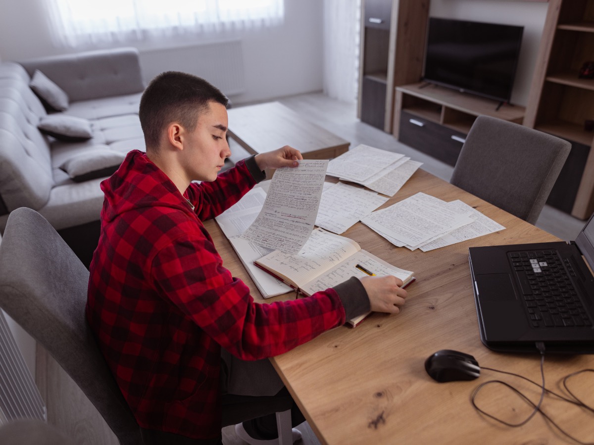 Student reviewing marked practice questions after a mock